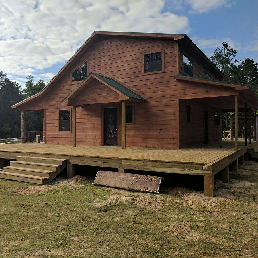 Custom shell home built on Texas property with a durable exterior and covered porch.